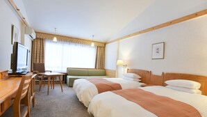 A hotel room with two beds, a desk with a chair, a television, and a window with curtains. - Tokachi Sahoro Resort (Shintoku)