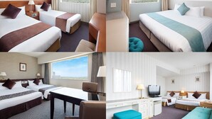 Une chambre d’hôtel avec deux lits, un bureau, une télévision et une vue sur la ville.