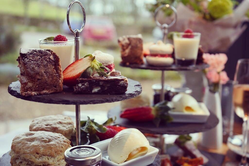 A tiered dessert display with various sweets and pastries.