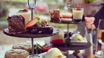 A tiered dessert display with various sweets and pastries.