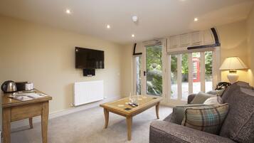 Suite | Living area | Flat-screen TV, DVD player