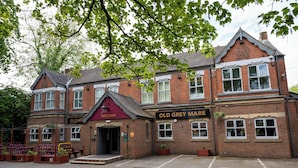 A traditional brick building with a sign reading "Old Grey Mare." - Old Grey Mare Hotel by Greene King Inns (Hull)