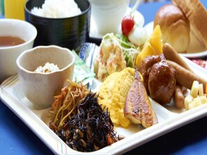 A variety of dishes including rice, a salad, and a meat dish, suggesting a meal setting. - Pearl Mizonokuchi (Kawasaki)