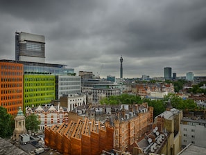A cityscape with a mix of modern and historic buildings, including a prominent tower and a green-roofed structure. - LSE High Holborn - Campus Accommodation (London)