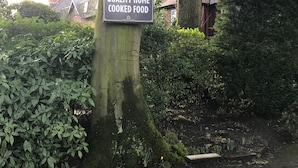A tree with a sign that reads "Fresh Finest Quality Home Cooked Food." - Eskdale Lodge (Sale)