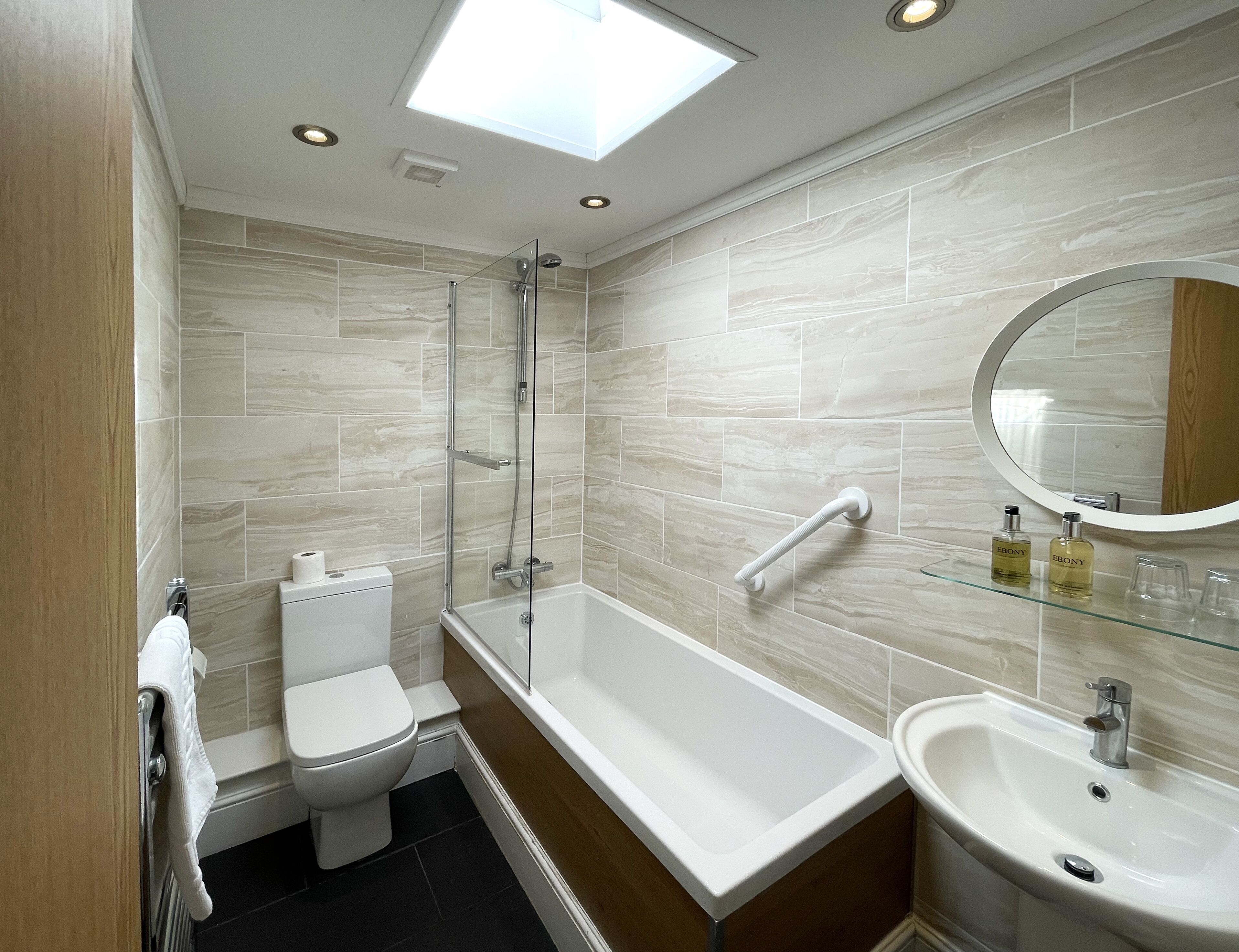 manfard | bathroom | designer toiletries, hair dryer, towels