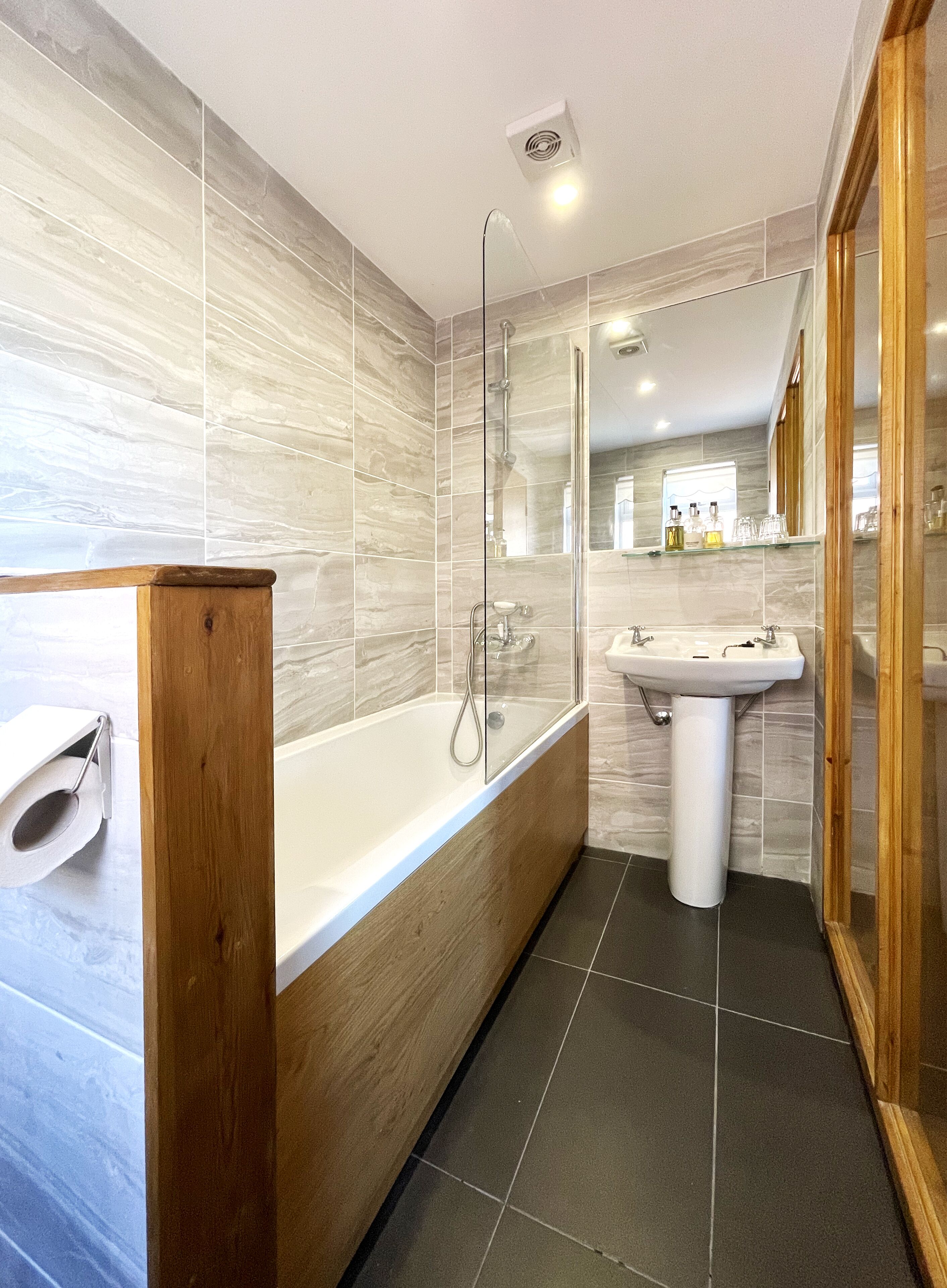 the rosado room | bathroom | designer toiletries, hair dryer, towels