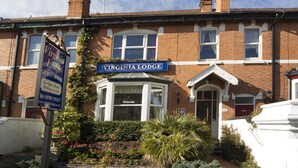 A traditional brick building with a sign reading "Virginia Lodge." - Virginia Lodge (Stratford-upon-Avon)