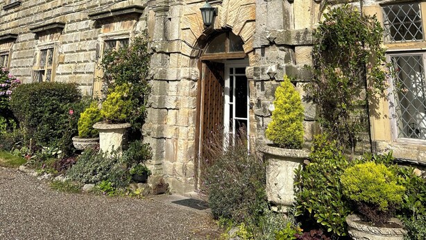 A historic stone building with multiple windows and a central entrance. - Moresby Hall (Whitehaven)