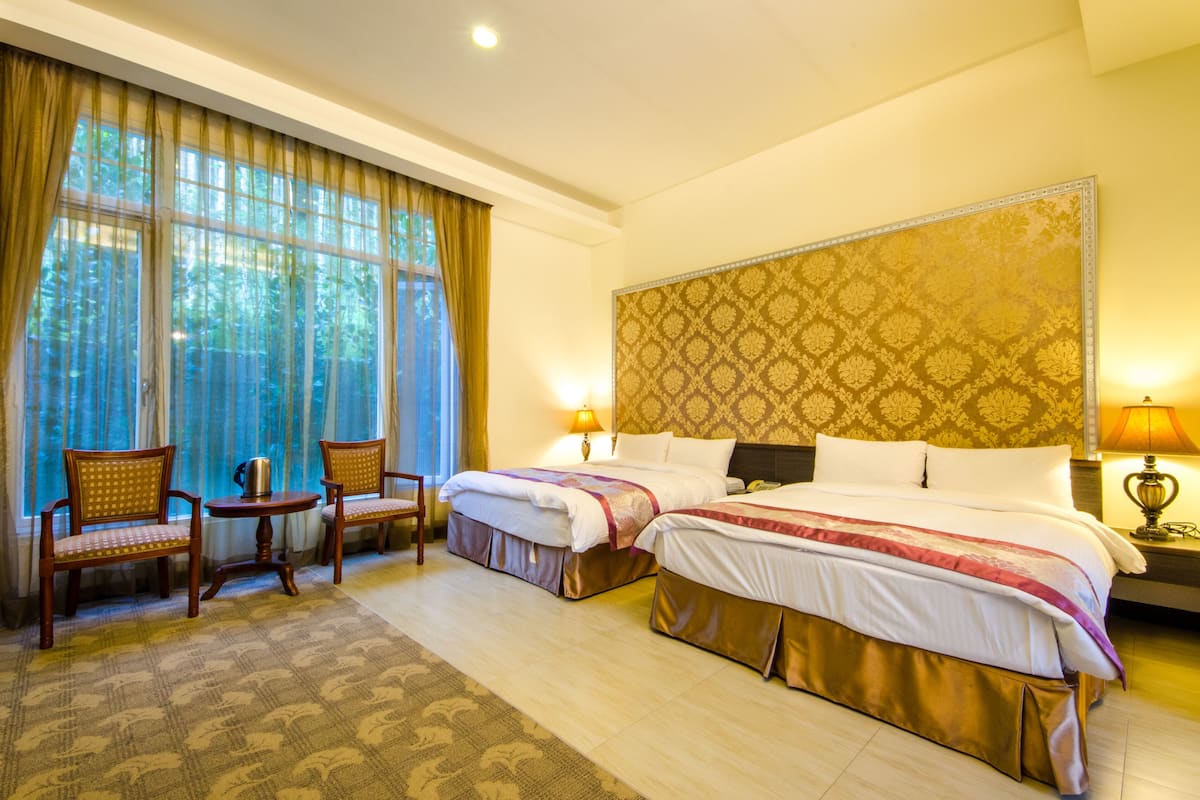 deluxe quadruple room | premium bedding, in-room safe, desk, blackout curtains