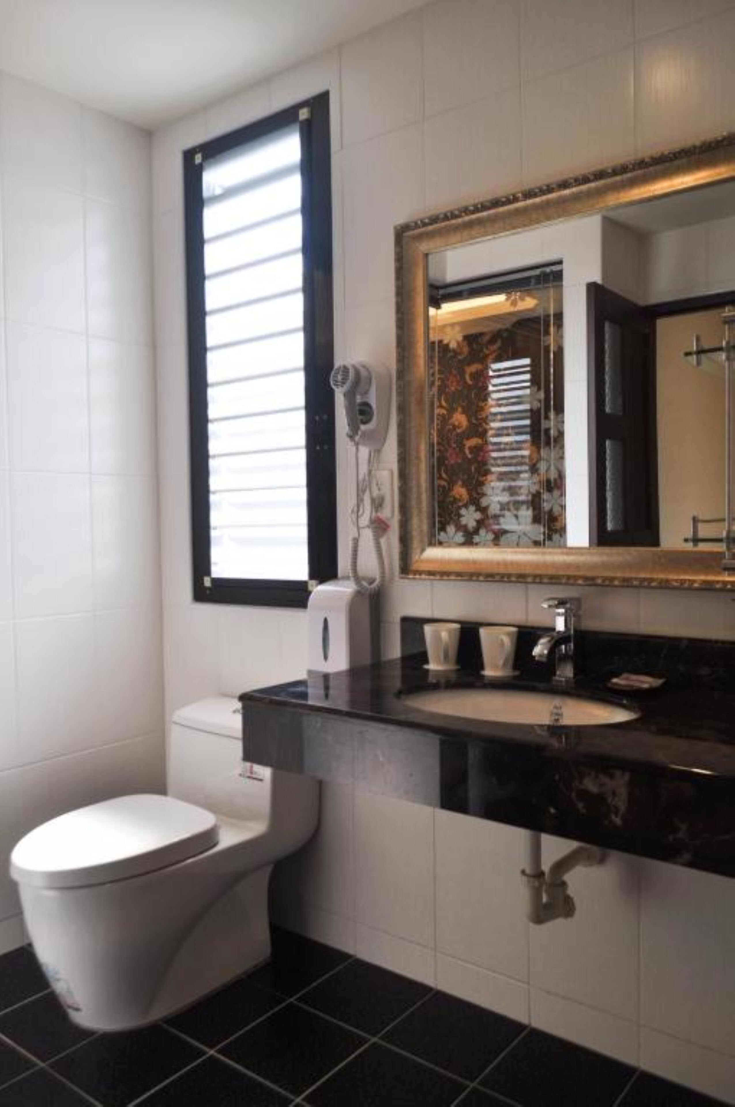 separate bathtub and shower, hair dryer, slippers, towels