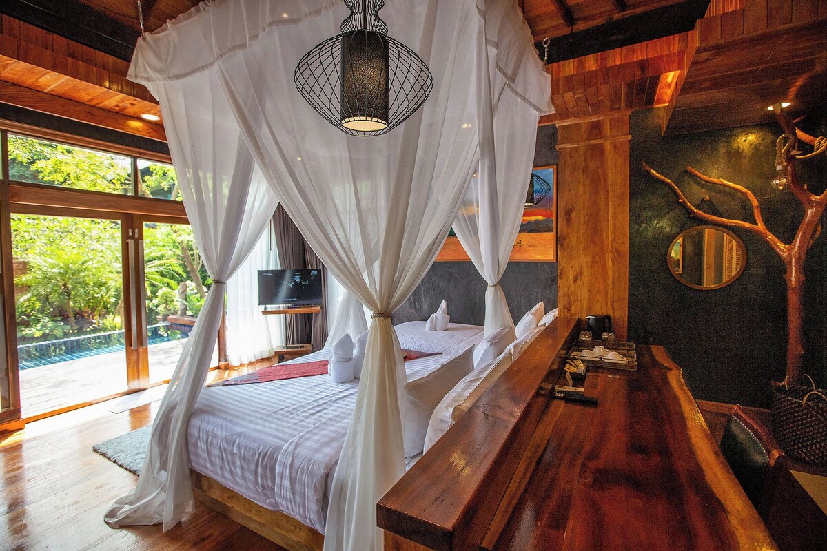 Family Pool Villa | Minibar, in-room safe, desk, individually decorated
