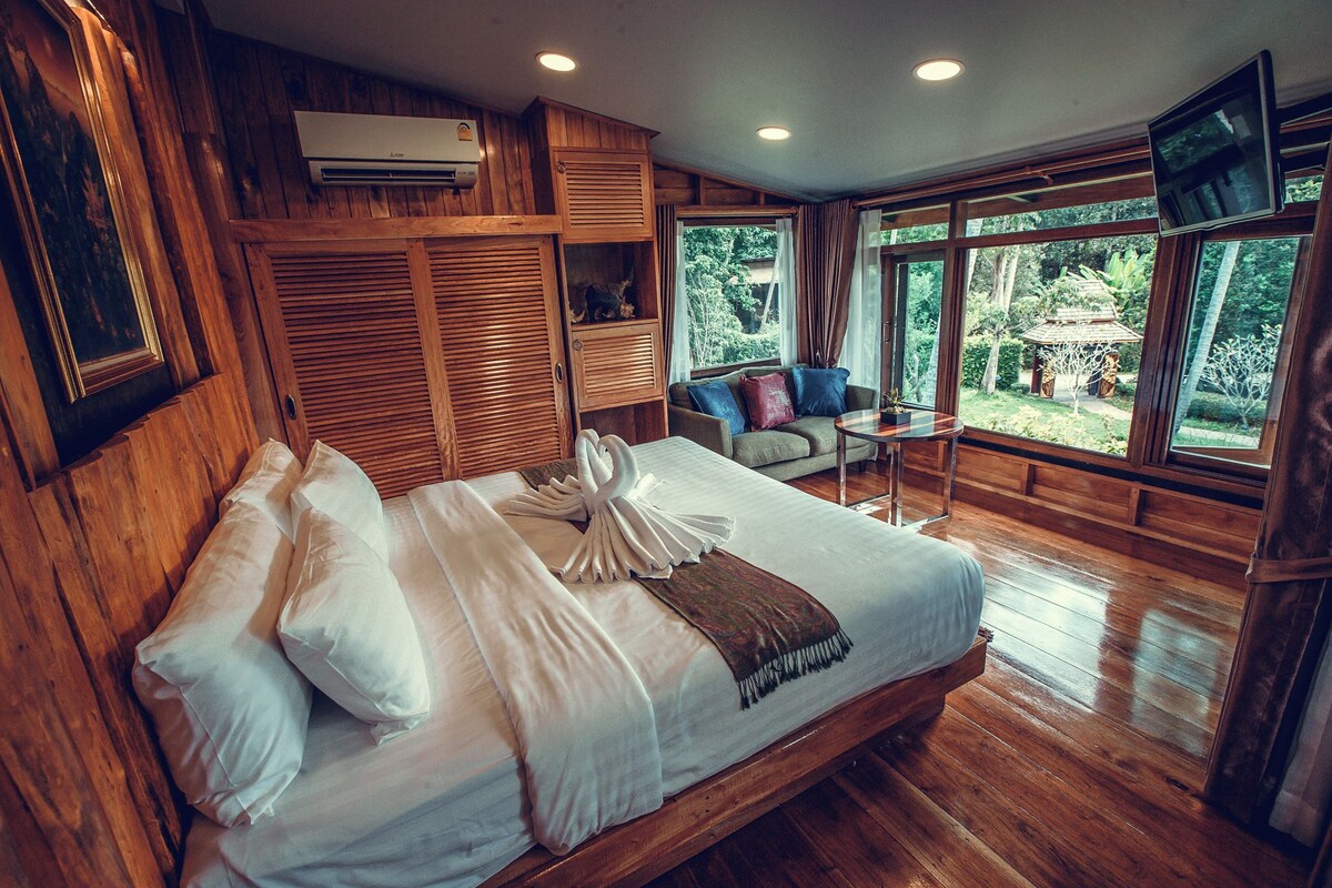 Family Timber House | Minibar, in-room safe, desk, individually decorated