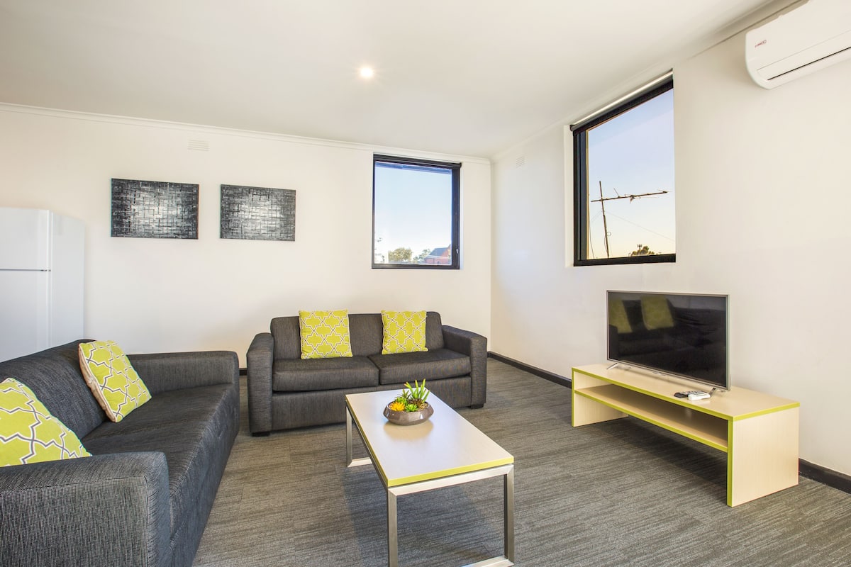 two bedroom apartment | living room | flat-screen tv
