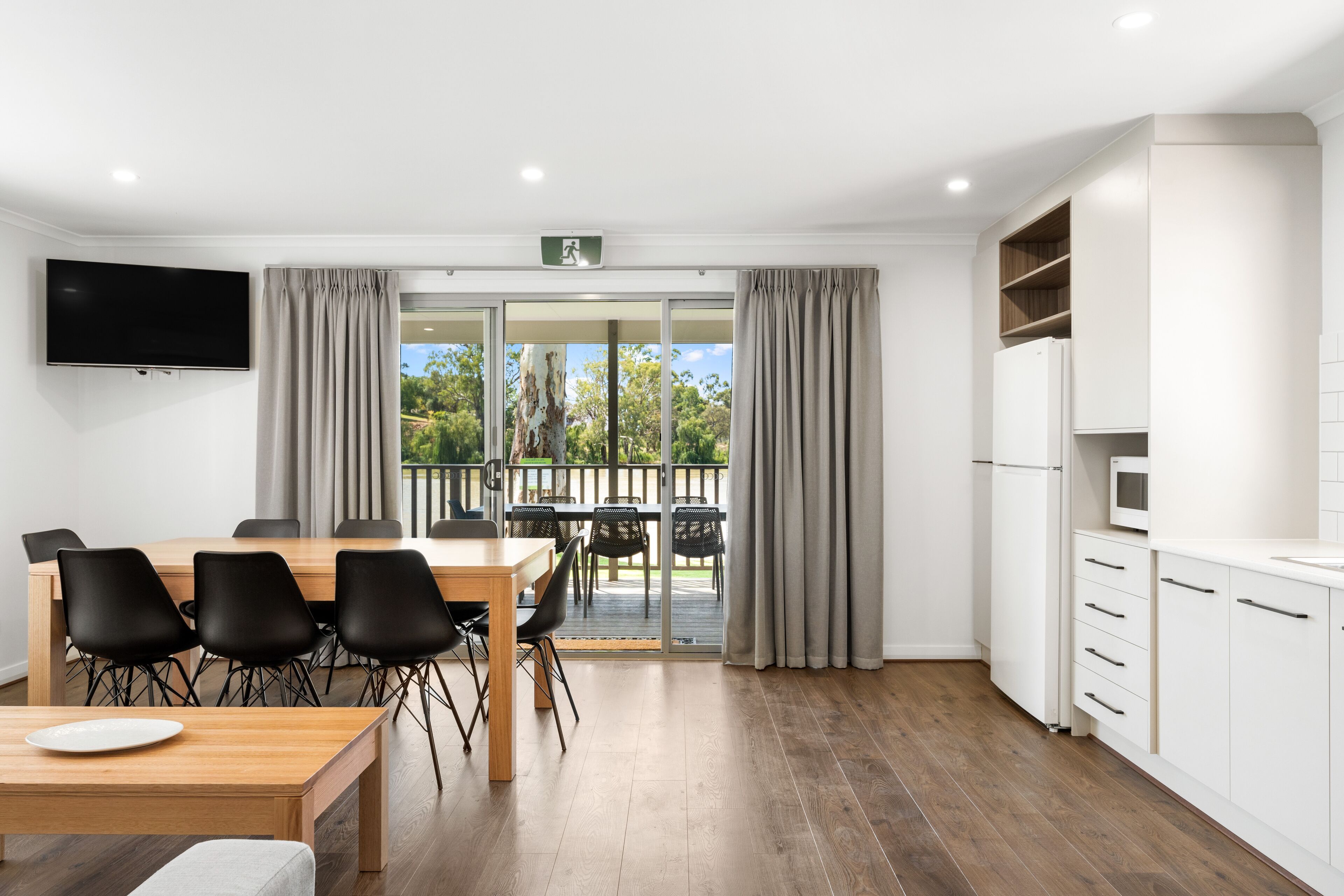 Premium Riverfront Cabin | Living area | 55-inch flat-screen TV with digital channels