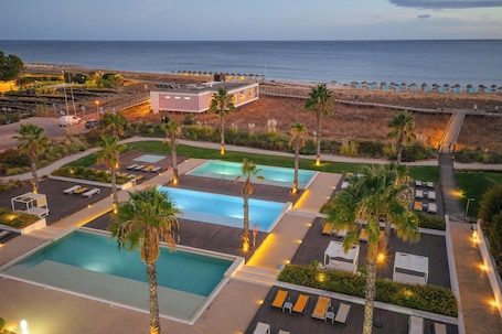 3 outdoor pools, pool umbrellas, pool loungers. Pestana Alvor South Beach, Premium Suite Hotel