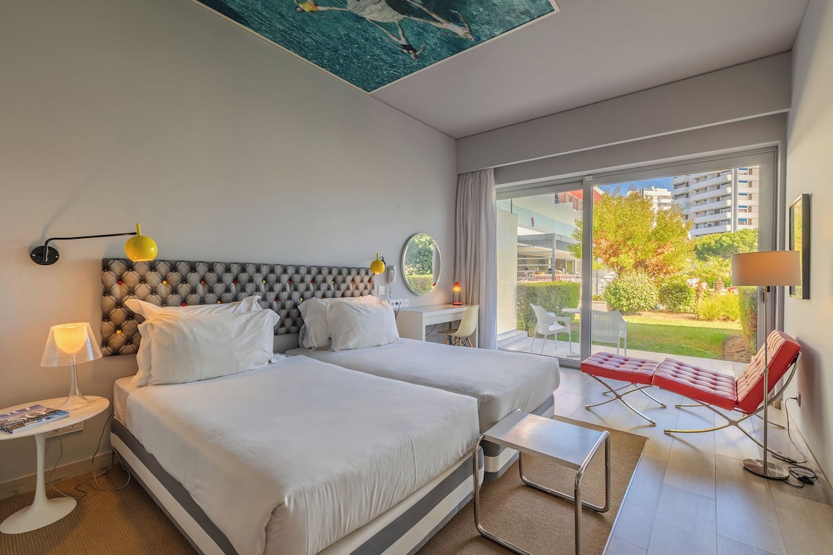 Deluxe Double or Twin Room, Pool View | Minibar, in-room safe, free WiFi, bed sheets