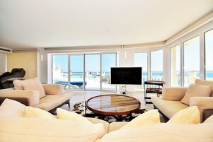 Luxury Penthouse, 2 Bedrooms, Ocean View | Living area | Flat-screen TV