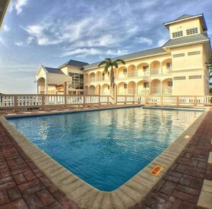 Outdoor pool, pool umbrellas, sun loungers