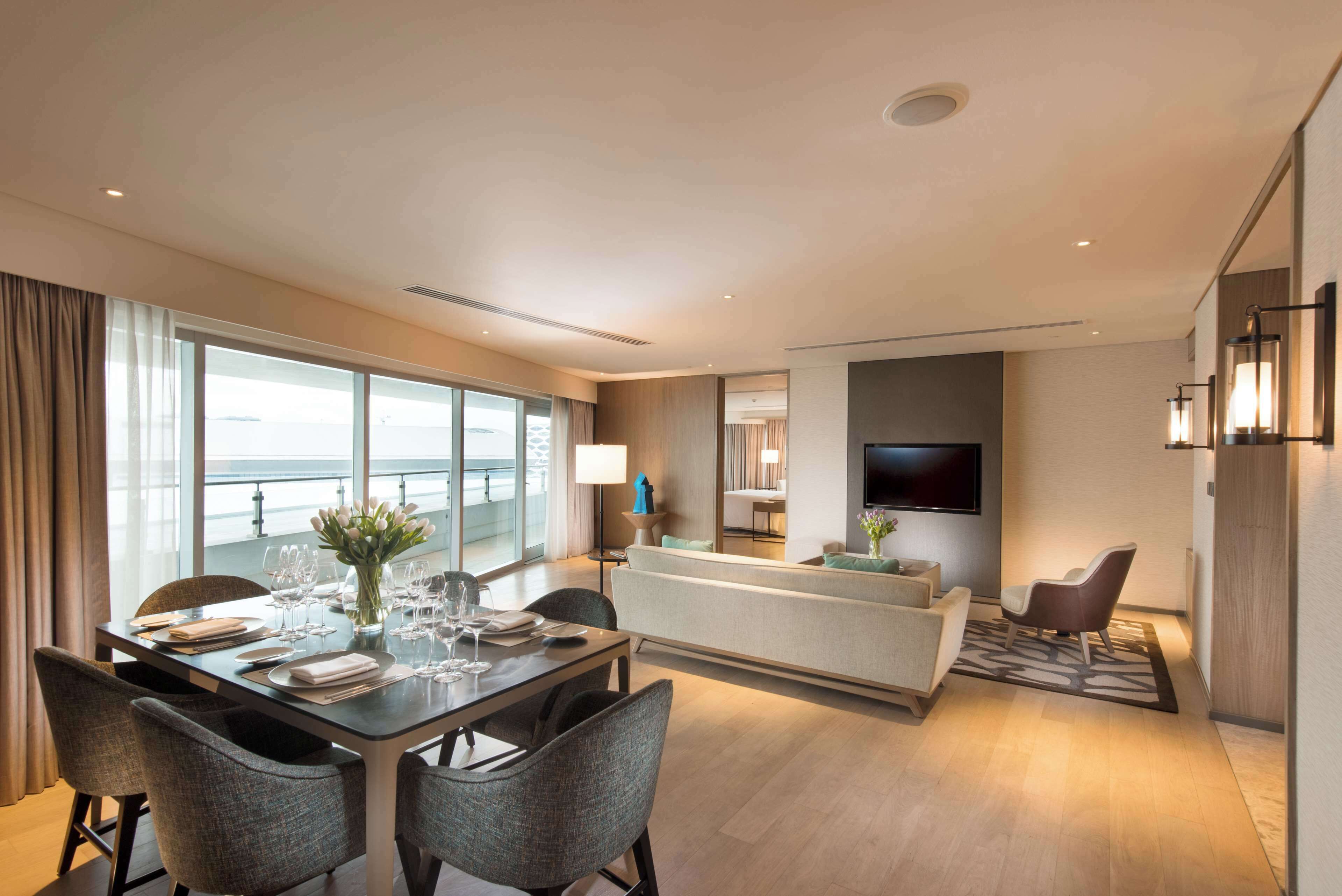 two bedroom ambassador suite-balcony | living area | 42-inch lcd tv with premium tv channels, tv, pay films