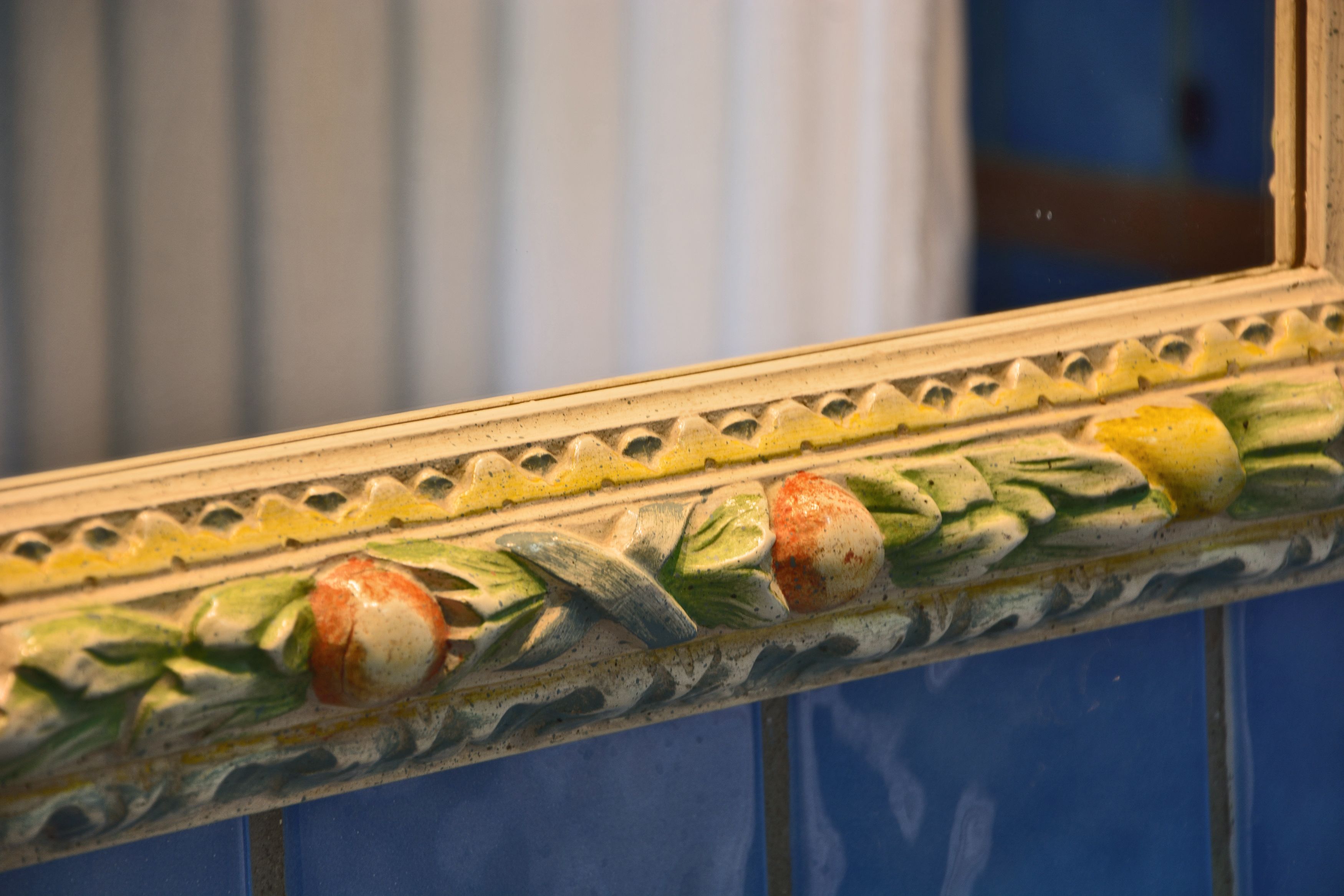 A decorative tile border with a floral pattern.