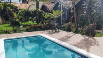 Outdoor pool, open 7:00 AM to 7:00 PM, pool umbrellas, sun loungers