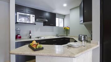 Fridge, microwave, cookware/dishes/utensils