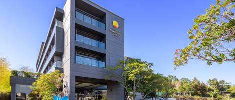 A modern building with a sign reading "Park Sunshine Jeju".