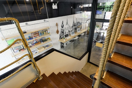 A staircase with wooden steps and a rope barrier.