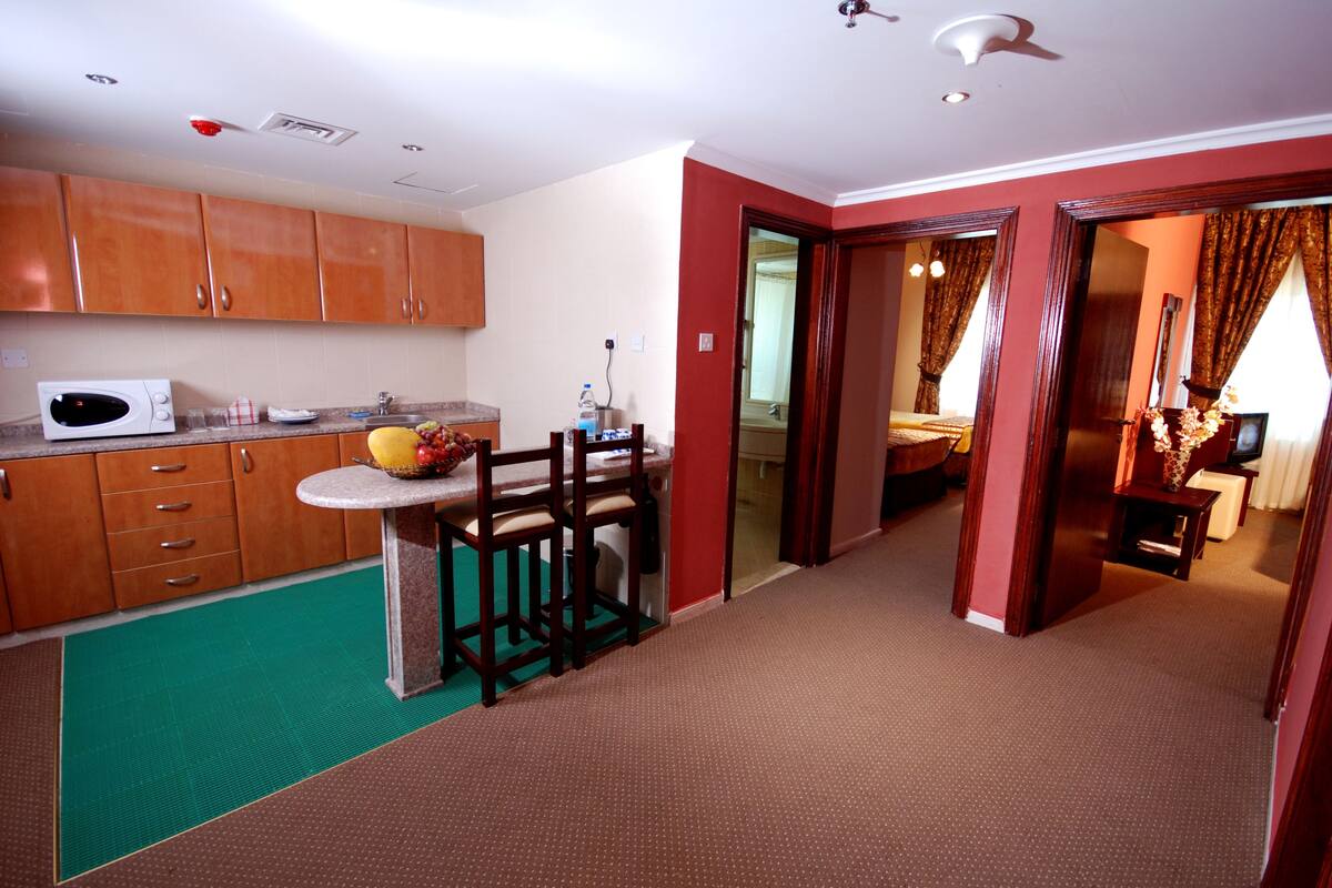 Family Suite, 2 Bedrooms | Living area | LCD TV, fireplace