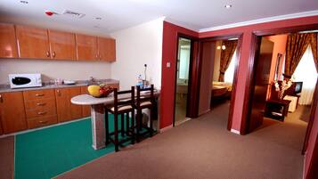 Family Suite, 2 Bedrooms | Living area | LCD TV, fireplace