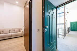 Apartment (1 Bedroom) | Living area | 32-inch Smart TV with cable channels