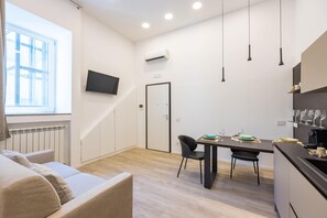 Apartment (1 Bedroom) | Living area | 32-inch Smart TV with cable channels