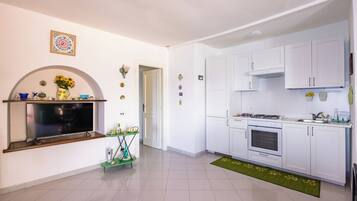 Apartamento (2 Bedrooms) | Cozinha americana privada | Fogão, máquina de café expresso