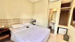 Standard Double Room, Courtyard View | In-room safe, desk, laptop workspace, iron/ironing board