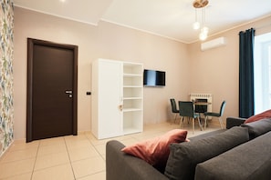 Apartment (1 Bedroom) | Living area | TV