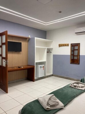 Family Quadruple Room, Garden View | Minibar, laptop workspace, blackout drapes, free WiFi - Pousada Pau Brasil Ubu (Anchieta)