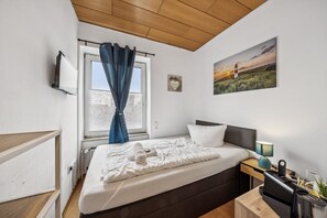 Desk, travel crib, free WiFi, bed sheets