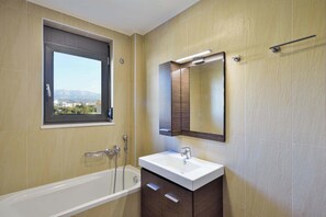 Apartment, Mountain View | Bathroom | Bathtub, hair dryer, towels, soap - Marena Apartments (Chania)