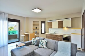 Apartment, Mountain View | Living area | 40-inch Smart TV with satellite channels