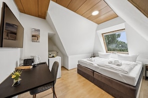 Desk, travel crib, free WiFi, bed sheets