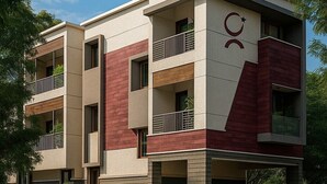 A multi-story building with a modern architectural design, featuring balconies and a parking area. - Zenova Stays (Chennai)