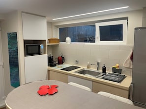 Fridge, microwave, stovetop, coffee/tea maker