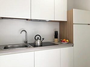 Fridge, microwave, stovetop, coffee/tea maker