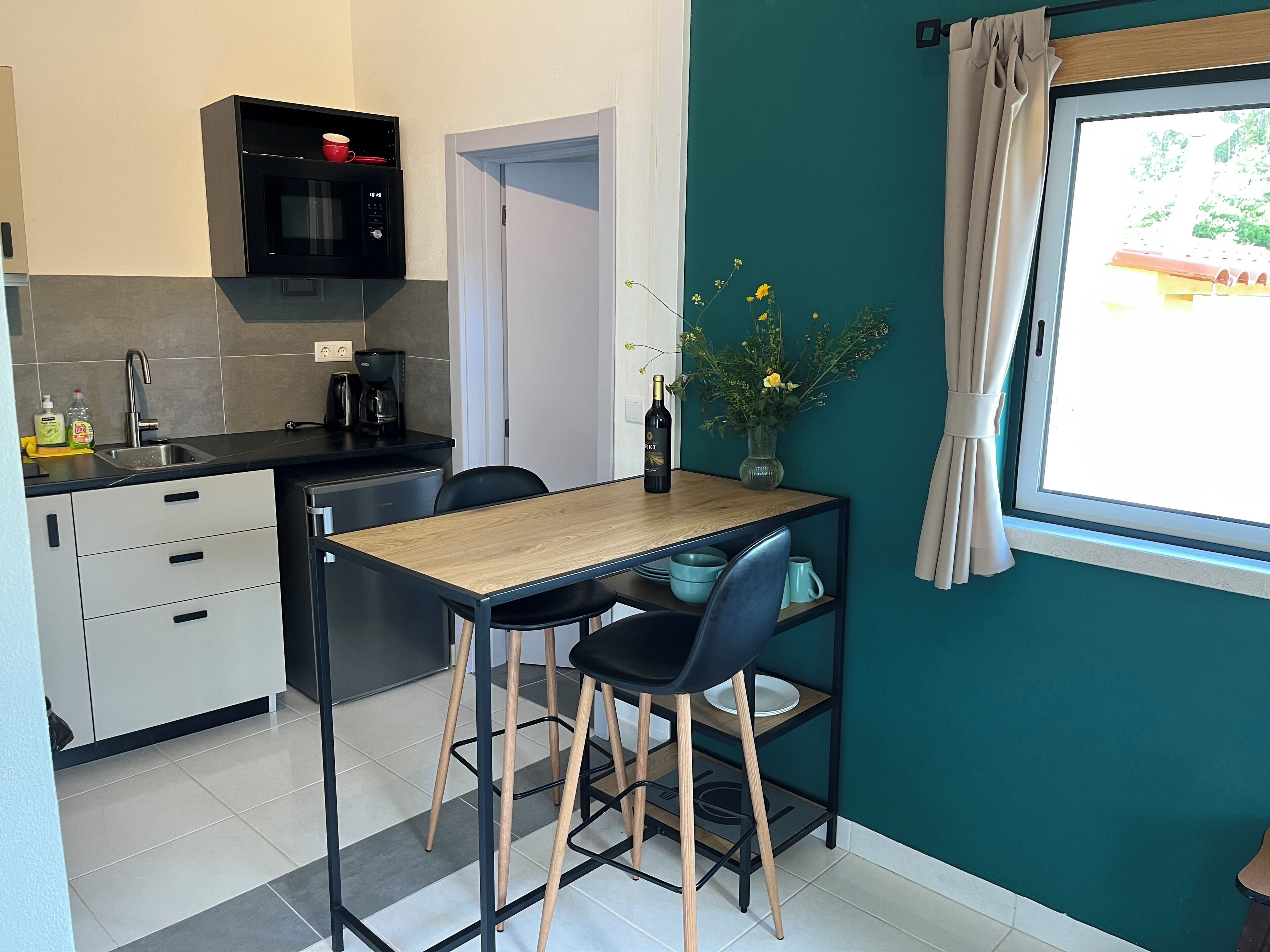 Fridge, microwave, stovetop, coffee/tea maker