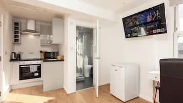 Mini-fridge, microwave, stovetop, cookware/dishes/utensils