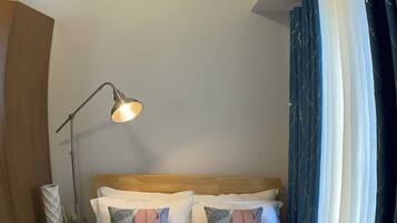 Desk, blackout drapes, soundproofing, iron/ironing board