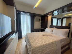 Comfort Studio | Desk, blackout drapes, soundproofing, iron/ironing board