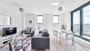 Apartment, 4 Bedrooms | Living area | 40-inch Smart TV with digital channels, iPod dock