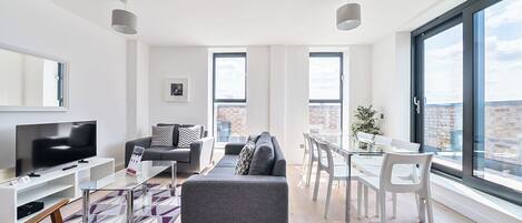 Apartment, 4 Bedrooms | Living area | 40-inch Smart TV with digital channels, iPod dock
